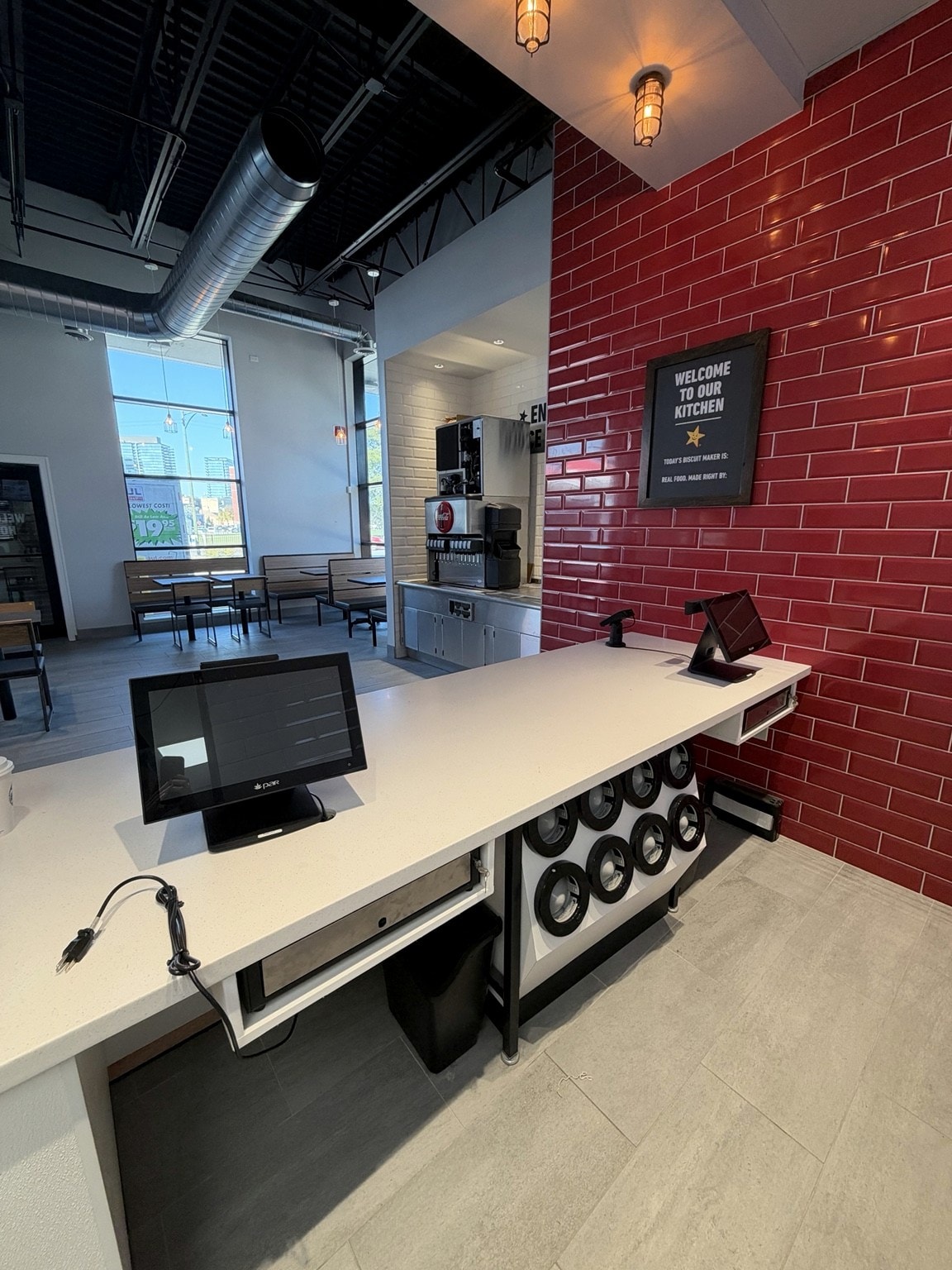 Service counter with Coca-Cola beverage station and POS